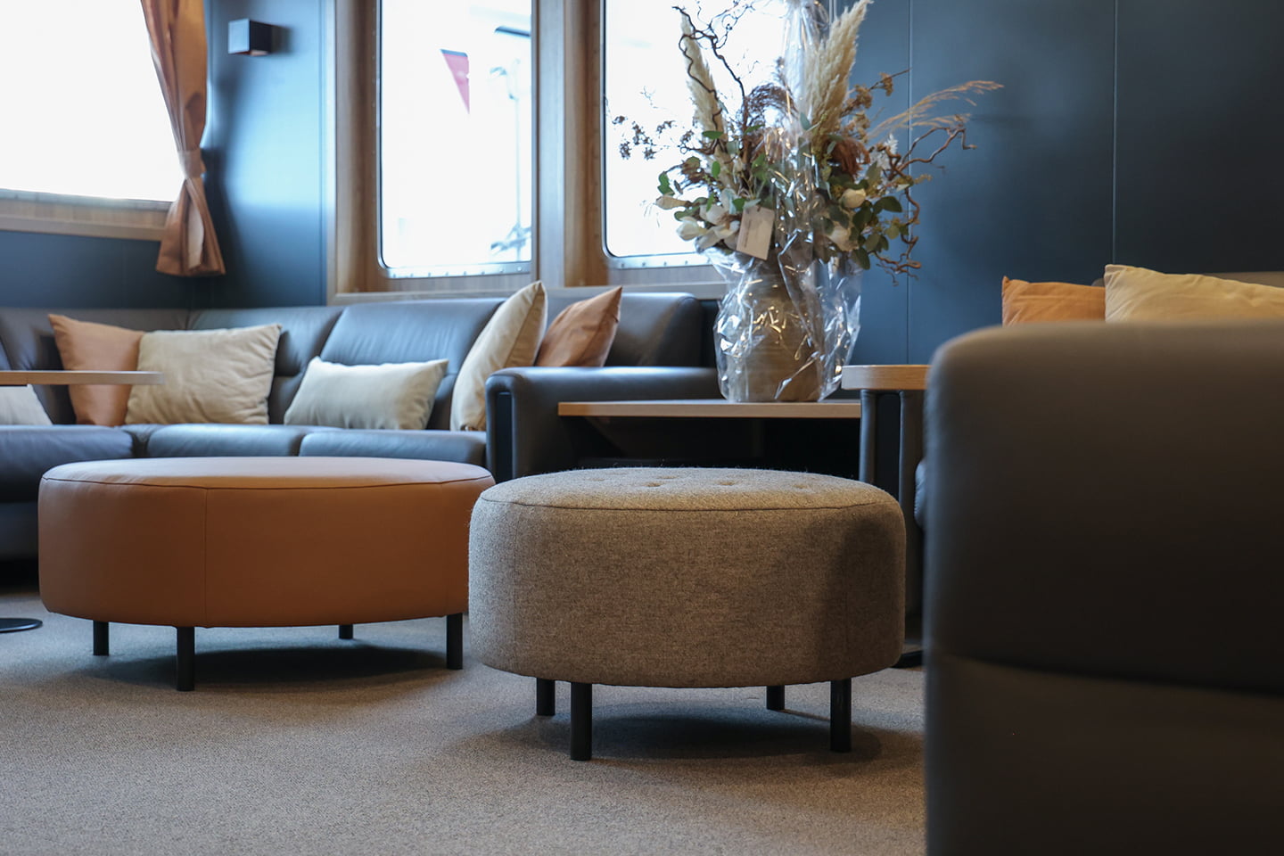 Ekornes poufs on board Ginneton